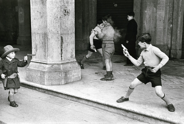 Henri Cartier-Bresson - Rome, Italy (Children Playing Cowboys with Guns)