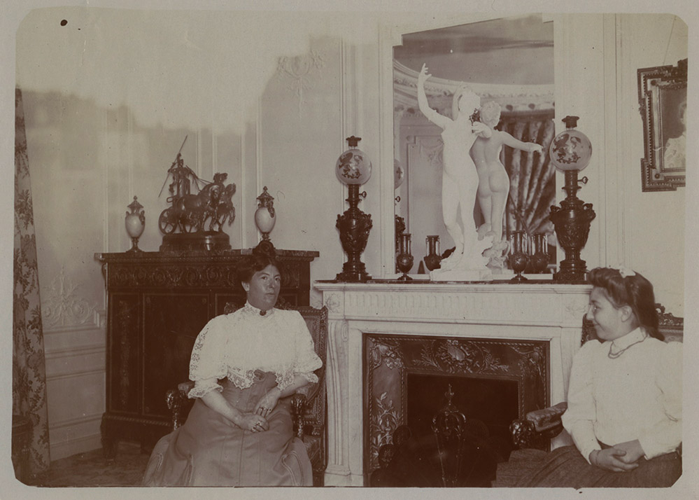 Two Women in Interior with Sculpture by Felix Charpentier's (French, 1858-1924) on Mantel of Fireplace