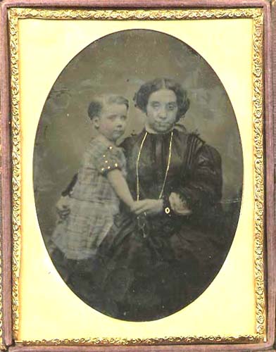 Anonymous - Woman with Long Necklace Holding Her Child