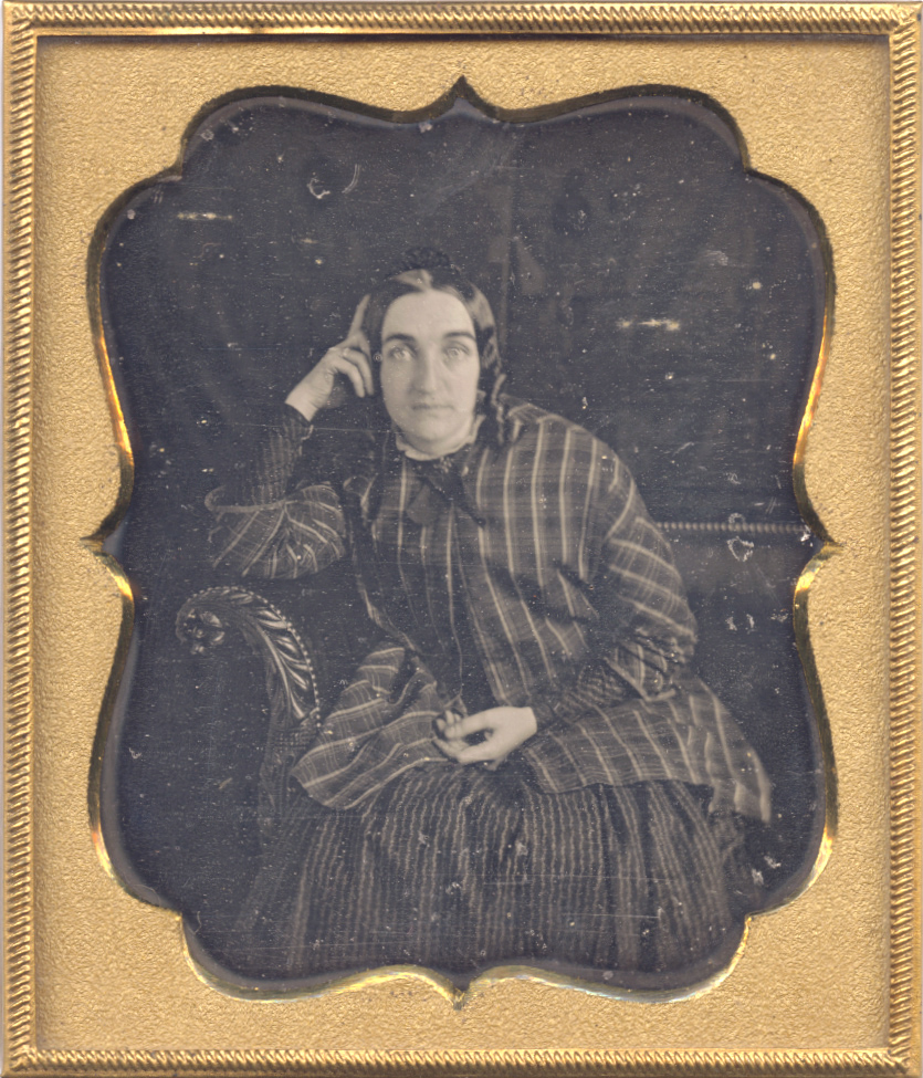 Anonymous - Woman in Plaid Jacket on Sofa