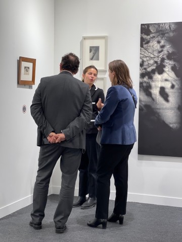 A group admiring the wonderful vintage Andre Kertesz iconic print of the pipe and glasses, perhaps one of the most important photos exhibited at the fair, in Galerie Francoise Paviot's booth.