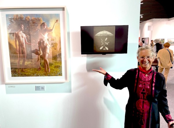 Artist Claudia Kunin in front of her works (one a print and the other a video) at Contemporary Works/Vintage Works booth.